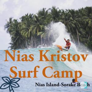a man riding a wave on a surfboard in the ocean at Nias Kristov Surf Camp in Lagudri