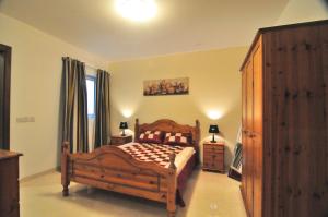 Cama o camas de una habitación en Superior Xlendi Lungomare Apartment