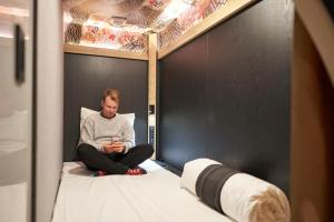 Giường trong phòng chung tại Resol Poshtel Tokyo Asakusa