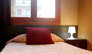 Postel nebo postele na pokoji v ubytování Hostal Cafeteteria Goya
