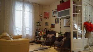 TV a/nebo společenská místnost v ubytování Hotel des Dames