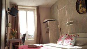 Postel nebo postele na pokoji v ubytování Hotel des Dames
