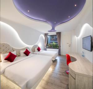 Ένα ή περισσότερα κρεβάτια σε δωμάτιο στο Avatara Resort