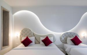 Ένα ή περισσότερα κρεβάτια σε δωμάτιο στο Avatara Resort