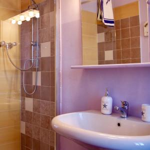 a bathroom with a sink and a shower at CAMINATA 415 in Fiorenzuola dʼArda +41 photos