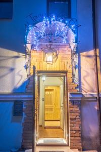 a building with a door with lights on it at Apartments in the Center, Grodno in Grodno