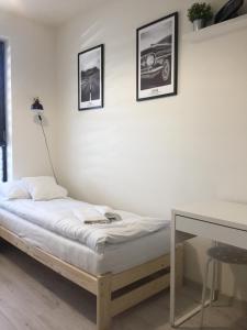 En eller flere senge i et værelse på Apartament Kraków Arena No 76
