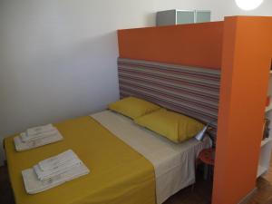 Postel nebo postele na pokoji v ubytování #iRicci3stanze