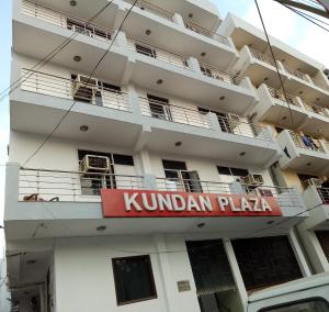 a building with a kundan plaza sign on it at Kundan Plaza Jasola in New Delhi