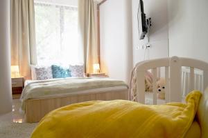 Posteľ alebo postele v izbe v ubytovaní Gyula Wellness Villa