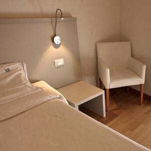 Postel nebo postele na pokoji v ubytování Albergo Accademia