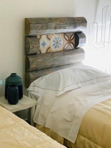 מיטה או מיטות בחדר ב-Trullo Labellavita
