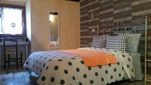 A bed or beds in a room at EL CAMPANARIO