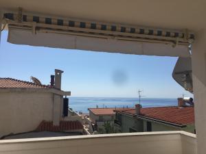 a view of the ocean from the balcony of a building at Casa Nuraghe Arvu in Cala Gonone