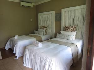 Nkanhi Centro de Conferências e Hotel 객실 침대