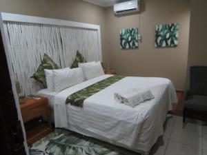 Nkanhi Centro de Conferências e Hotel 객실 침대