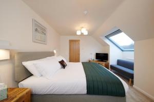 Tempat tidur dalam kamar di Woodlands Bed & Breakfast