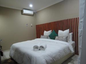 Nkanhi Centro de Conferências e Hotel 객실 침대