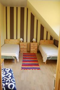 A bed or beds in a room at Järvesilma Tourism Farm