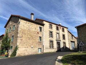 a large brick building with a street in front of it at Large 100 year old house in lovely walking area in Fayet-Ronaye