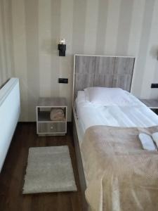 Letto o letti in una camera di Cozy House Kazbegi