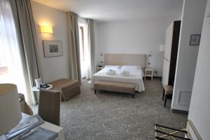 Postel nebo postele na pokoji v ubytování Albergo Accademia