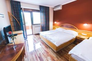 Postel nebo postele na pokoji v ubytování HOTEL SMUK
