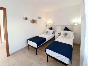 Ένα ή περισσότερα κρεβάτια σε δωμάτιο στο Villino Turchese Budoni