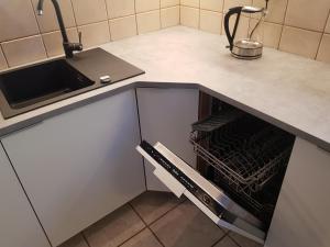 Kuchyňa alebo kuchynka v ubytovaní Toruńska 6