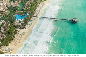 an aerial view of a beach with a pier at Jumeirah Dar Al Masyaf Dubai in Dubai