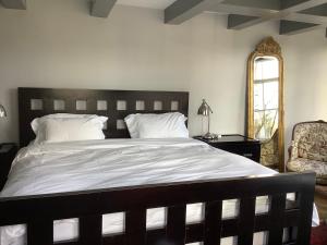 A bed or beds in a room at Former Rembrandt workshop two bedroom B&B