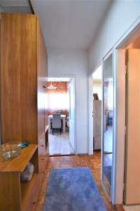 a hallway with a living room and a dining room at Autokomanda Apt. with Beautiful View near Center! in Dedinje