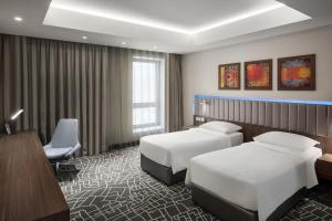 Park Inn by Radisson Makkah Aziziyah客房内的一张或多张床位