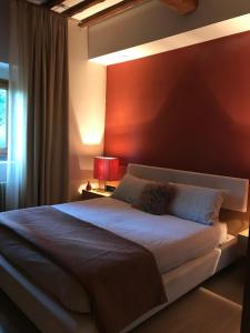 Postel nebo postele na pokoji v ubytování Appartamento in Villa con Piscina - Mhateria Relais