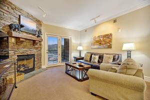 a living room with a couch and a fireplace at Baskin's Creek Condos III in Gatlinburg