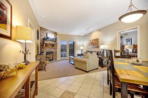 a dining room and living room with a dining table at Baskin's Creek Condos III in Gatlinburg