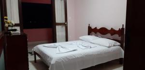 En eller flere senge i et værelse på Casa Premium Entre o Verde e o Mar + 33 billeder