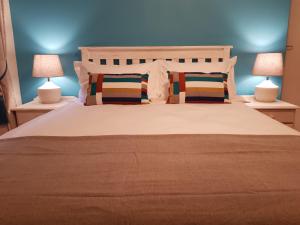 Säng eller sängar i ett rum på Bushys Oak