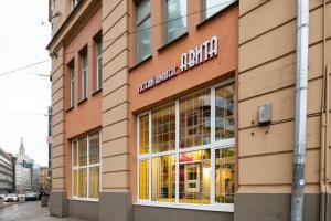 a store front with a sign on the side of a building at Avita Krasnye Vorota in Moscow