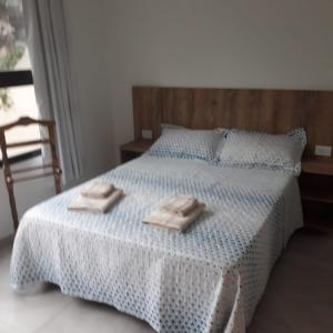 Кровать или кровати в номере Depto Temporario La Plata