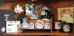 a shelf with a bunch of clocks on it at The Artist House in Key West