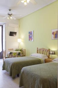 Postel nebo postele na pokoji v ubytování Hostal Los Alpes