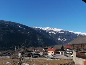 a town with a mountain in the background at Ledererhof in Oberlienz