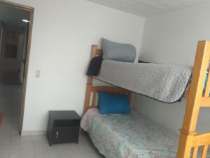 A bunk bed or bunk beds in a room at APARTAHOTEL CALLE 80 Bogota por SEMANAS