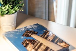 a book on a table with a picture of the eiffel tower at Monteborre in Cento