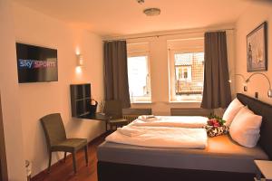 TV a/nebo společenská místnost v ubytování Hotel Walsroder Hof