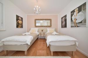 Posteľ alebo postele v izbe v ubytovaní MM Luxury Apartments GOLD & RUBIN