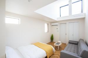 Postel nebo postele na pokoji v ubytování スポルト東京