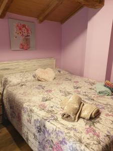 a bedroom with a bed with a floral bedspread at Casetes Joan de Pataca 5 in Deltebre +14 photos