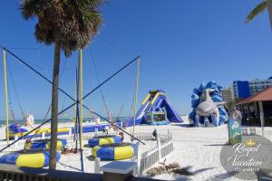 a beach with some slides and a water park at The Avalon Royal Dream in Clearwater Beach